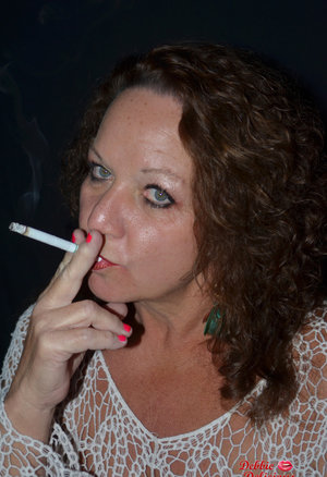 18 year old girl Megan Rain removes her sandals and then clothes to pose naked